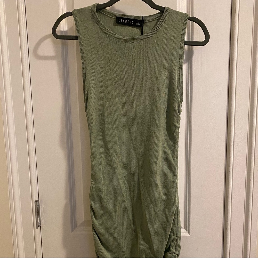 Lioness green dress, cinches on side.